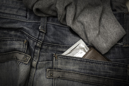 Condom in package in jeans