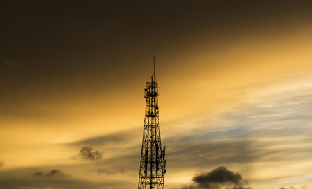 communication tower on sunset skyの写真素材