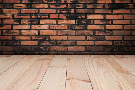 Empty room wood floor with old brick wallの写真素材