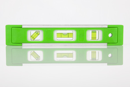 Green bubble level isolated on a white backgroundの写真素材