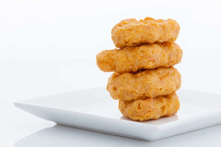 Fried chicken nuggets on white dishの写真素材