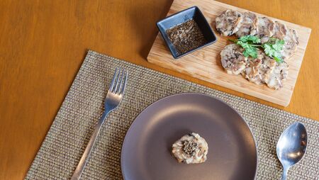 stuffed pork leg on dish served with sauce , Asian style foodの写真素材