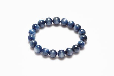 Lucky stone bracelet on white background.の写真素材
