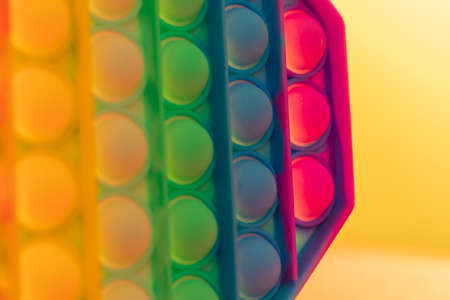 Close up shot of octagon pop it toy on colorful background