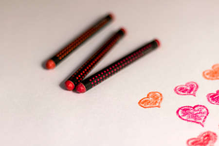 Sketch of heart shapes by colored crayon on canvas paperの写真素材