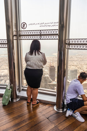 Dubai, UAE - 07.18.2021 -Visitors at the highest observation deck in world. 125th floor of Burj Khalifaのeditorial素材