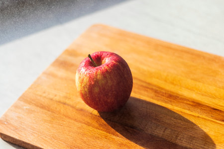 Close up shot of an apple and water droplets in itの写真素材