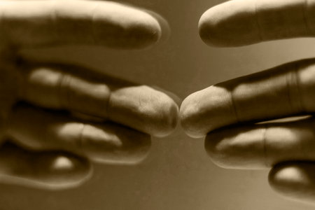Close up shot of a hand's reflection in the mirrorの写真素材