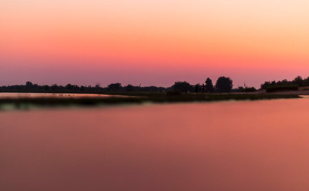 Shot of a dramatic sunset in the parkの写真素材
