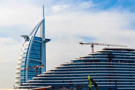 Dubai, UAE - 12.01.2022 - View of a Burj Al Arab, world's only 7 star hotel and Marsa Al Arab, 5 star hotel under constructionのeditorial素材