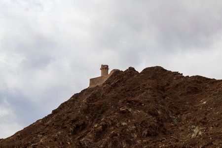 Old arabic watch tower on the hill.の写真素材