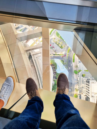 Concept shot of the city street trough the glass floor of the skyscraperの写真素材