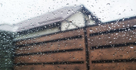Concept shot of the car window covered by rain dropsの写真素材