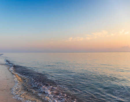 Shot of the dramatic sunrise by the sea.の写真素材