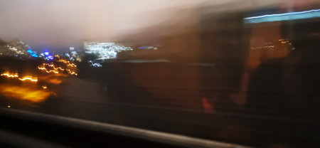 Conceptual shot of the light trails captured from the window of the moving trainの写真素材