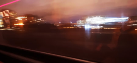 Conceptual shot of the light trails captured from the window of the moving trainの写真素材