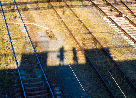 Concept shot of the couple casting shadow down from the bridgeの写真素材