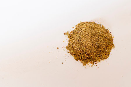 Close up shot of the grounded spices and herbs on the white background