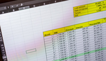 Shot of an dark mode excel sheet on computer screen showing bank loan amortization table.の写真素材