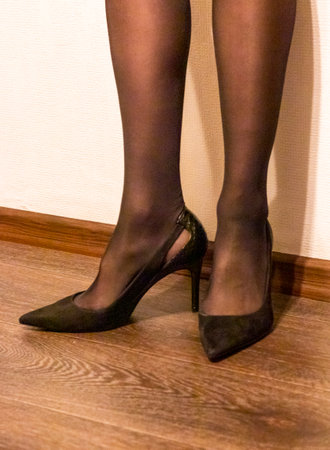 Woman in black stockings and black high heels shoesの写真素材