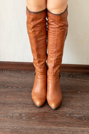 Skinny woman wearing stylish leather tight bootsの写真素材