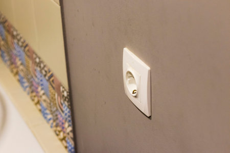 Shot of the decorative tiles and socket in the bathroomの写真素材