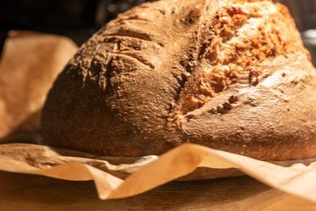 Shot of the freshly baked loaf of home made rye bread in the ovenの写真素材