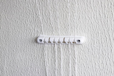 String from the cloth dryer fixture on the wallの写真素材