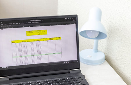 Shot of an excel sheet on computer screen showing bank loan amortization table.