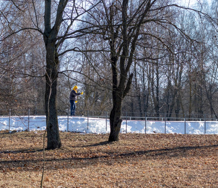 People enjoying skiing outdoors on sunny but cold weather.の写真素材