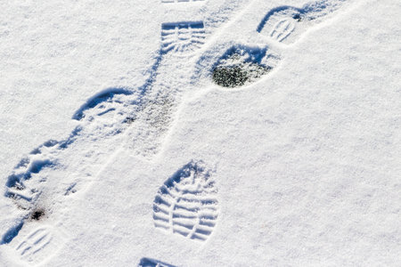 Multiple footprints on the snowの写真素材