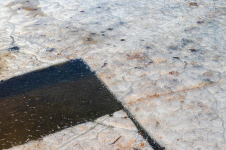 Lake covered with thawed iceの写真素材