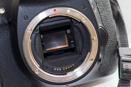 Close up shot of partially damaged opened camera bodyの写真素材