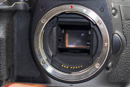 Close up shot of partially damaged opened camera bodyの写真素材