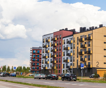 05.05.2025 - Minsk, Belarus. Shot of the stylish, modern, urban, residential suburb called Zelenaya gavan or Green Bay, where buildings have ergonomic design and vivid colorsの写真素材