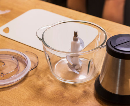 Dismantled electrical kitchen chopper on the counter top