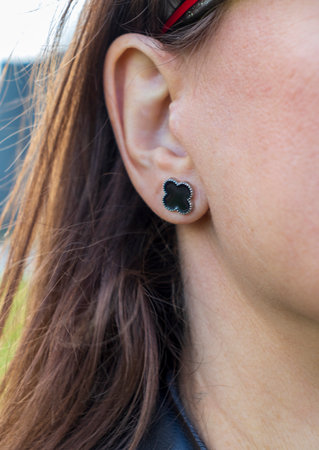 Shot of the popular earring design shaped as a four leaved cloverの写真素材