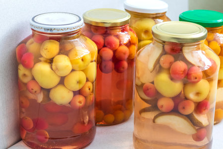 Canned compote in jars of various fruits and berries. Food