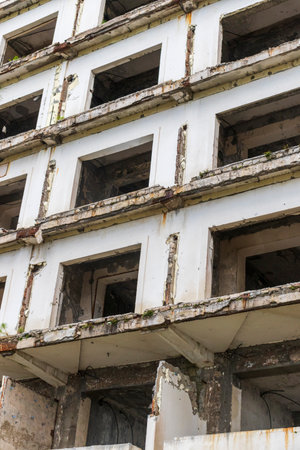 Facade of the abandoned high rise building construction site