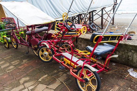 Broken, pedal, four wheeled bicycle