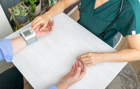 Female doctor measuring blood pressure of the patientの写真素材