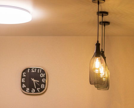 Reflection in the mirror of the decorative pedant lights in the modern apartmentの写真素材