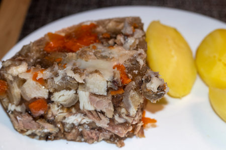 Close up shot of the aspic and home style baked potatoes