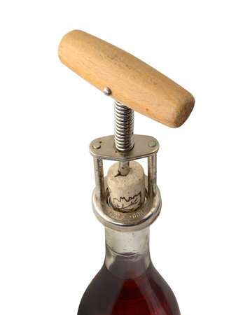 closeup of bottle of vine with corkscrew on white backgroundの写真素材