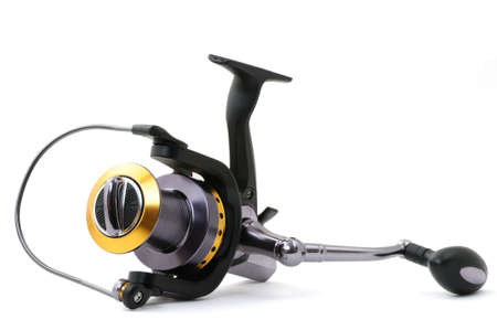 isolated fishing reels on white backgroundの写真素材