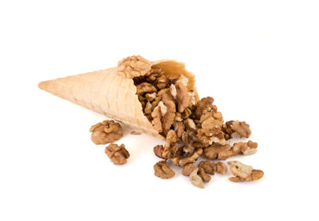 isolated cornet with fresh walnut on white background