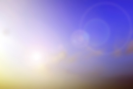 Blurred colour nature background with flare and bokehの写真素材