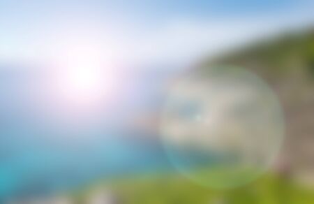 blurred nature background of sea sky and islands with flareの写真素材