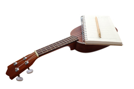 Notebook and ukulele Isolated on White Background の写真素材