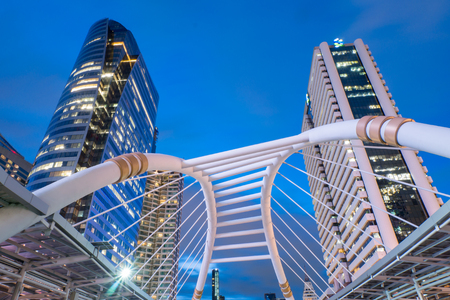 BANGKOK  MAY 20 : Bangkok downtown at night Sathorn bridge intersection Bangkok Landmark sky walker at the center connected to electric train station on May 202014 in Bangkok Thailandのeditorial素材
